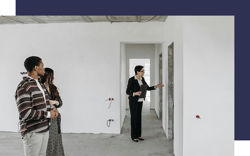 Real estate agent shows new apartment to a young couple