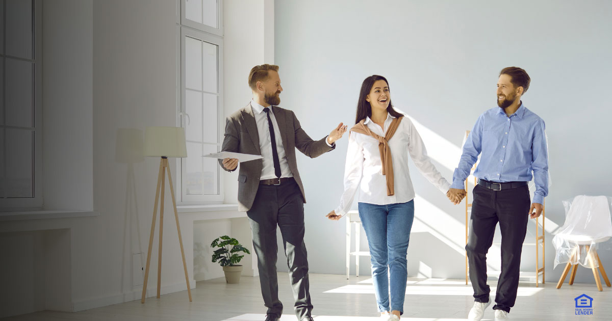 Multicultural couple in Virginia touring a modern open house with a checklist in hand, exploring home loan options.